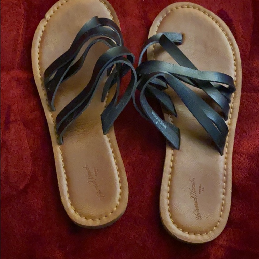 Black sandals with brown base color